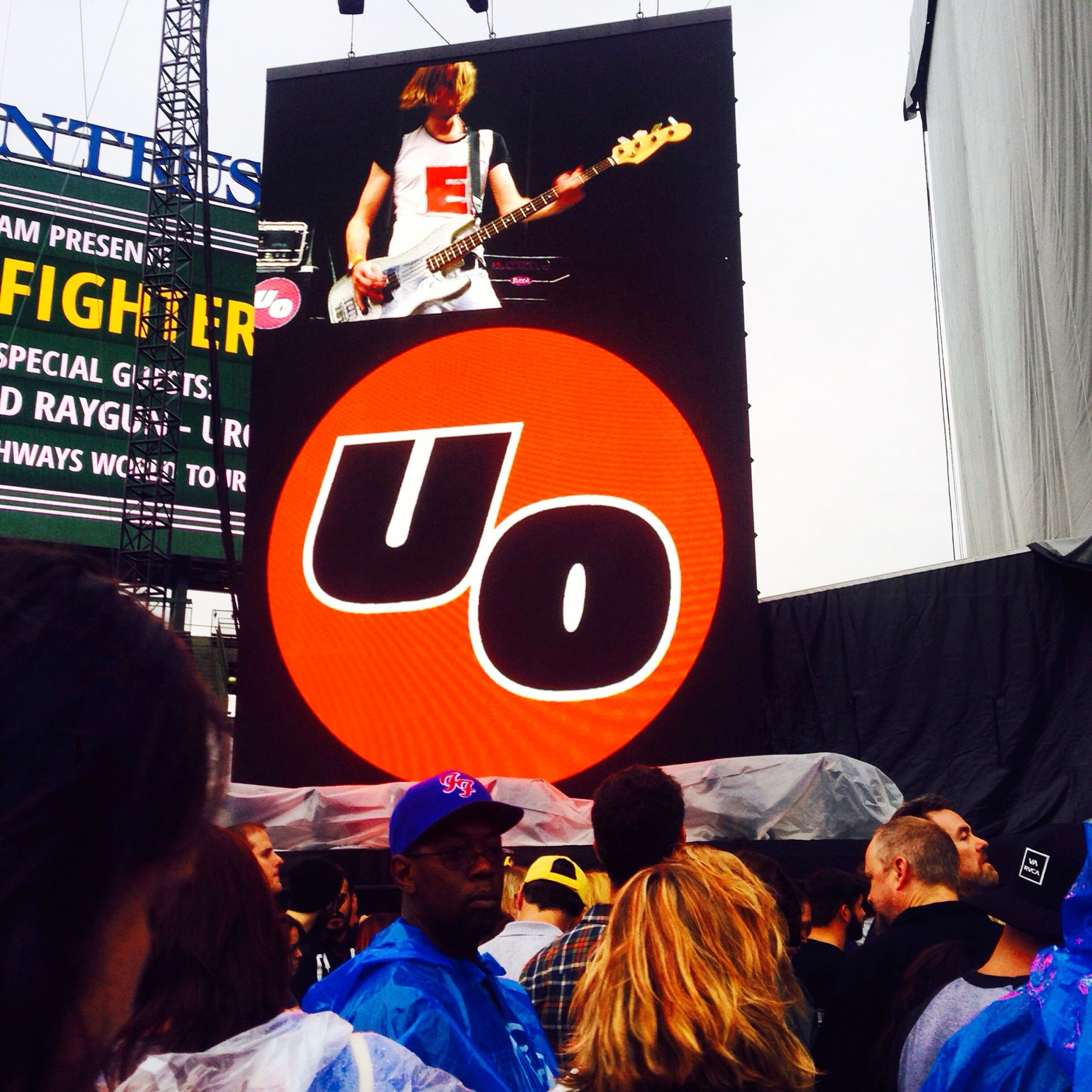 Adam Arling performing with Urge Overkill, shown on the venue jumbotron